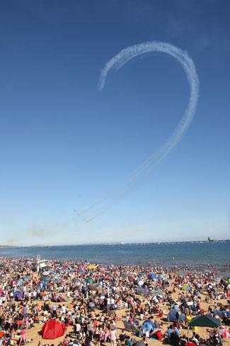 Saturday Flying display. A packed Bournemouth beach watch the Blades.