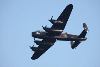 Saturday Flying display. Lancaster from the Battle of Britain memorial flight makes a solo run along the beach.