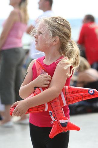 Pictures from the final day of the Bournemouth Air Festival 2011. Tia Lavell,5 , from Upton came with her family  to pay respects to Red Arrows pilot Jon Egging.