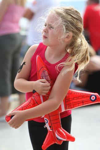Pictures from the final day of the Bournemouth Air Festival 2011. Tia Lavell,5 , from Upton came with her family  to pay respects to Red Arrows pilot Jon Egging.