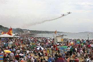 Pictures from the final day of the Bournemouth Air Festival 2011. The Breitling  Wingwalkers overfly a packed Bournemouth beach.