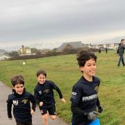 Over 100 members of Oakmeadians RFC are cumulatively walking, running or cycling 10,825 miles, the distance travelled by the international teams during the Six Nations championship, before the end of the final day of the tournament on March 20