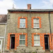 A mid-terraced property in North Allington, Bridport, will go under the hammer in July. Picture: Savills