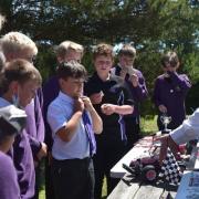 Dorset Model Car Racing Club have come to the assistance of Highcliffe school to help renovate their model car racing track and help establish a lunchtime club for Year 7 students. Photo from Highcliffe School