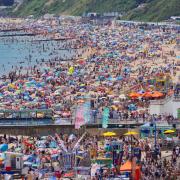 People enjoy the weather on Bournemouth beach in Dorset.  Picture date: Saturday July 17, 2021. PA