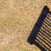 A Generic Photo of parched lawn with shadow of wooden deckchair. See PA Feature GARDENING Lawn. Picture credit should read: Alamy/PA. WARNING: This picture must only be used to accompany PA Feature GARDENING Lawn...
