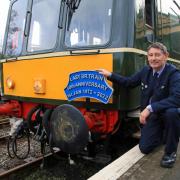 Peter Frost next to the SR Wareham Class 117 heritage diesel train at Corfe Castle, Wareham