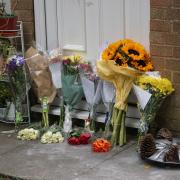 Floral tributes have been left for a man who died in a flat fire in Poole.