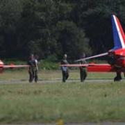 Millitary staff inspecting the grounded Red Arrows aircrafts. Picture: Richard Crease.