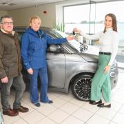 Gary and Diane Booth with Hendy retail sales advisor Chloe Arnold.