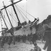 The three masted scooner Madeleine Tristan was driven on to Chesil Cove, and thrown up high on to the beach where she lay for many years as a prominent landmark