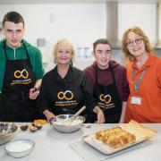– Portfield School Sixth Form student Luke, with Lesley Waters, student Jack and Autism Unlimited CEO Siún Cranny.