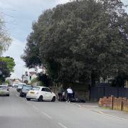 Police have responded to a crash in Parkstone between a car and motorcycle. 