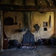 Witch post and fire place, in 'Stang End' longhouse, Ryedale-Folk-Museum