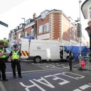 BIG OPERATION: Police at the scene of the murder in Roumelia Lane, Boscombe