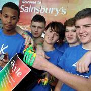 FOR KYLE: Friends of Kyle Rees, inset, sell their charity wristbands and ladybugs in his memory at Sainsbury’s Castlepoint. Pictured from left are Ellis Reeves, Louis Rylance, Sintija Morgan, Dan May and Reece McAneny