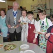 DISHING UP: Mayor of Christchurch, Cllr Peter Hall, with students from St Joseph’s Primary School