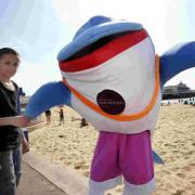SQUEAK TO MEET YOU: Daphne the Dolphin meets Nathan Molinari on Bournemouth Beach