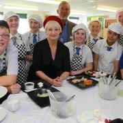 FOODIES: Students from The Grange School take part in the semi-finals of the Christchurch Food Festival competition, with judging chef Lesley Waters in the red beret