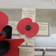 SYMBOL: Wreath of poppies placed at La Ferte Sous Jouarre Memorial in France by Jenny Young for men of Bournemouth killed in WW1. Include Private L A Beare and names of five other Bournemouth soldiers