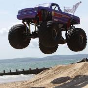Monster truck show on the beach during last year's Wheels Festival