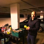 Pete Roberts from The Thomas Tripp in Christchurch serving food to the homeless in Saxon Square car park