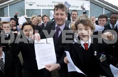 Winton Arts and Media College head teacher Ben Parnell (purple tie) celebrates a glowing Ofsted report with staff and pupils. 

