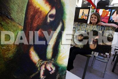 Poole High School, Year 13 art student Katie Bligh (17) with her work.  