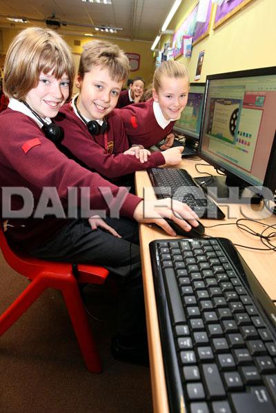 Branksome Heath Middle School,   Pictured L-R are Josh Pengelly,10, Brandon Northover,9, and Keisha Holden,9, working in the IT suite.