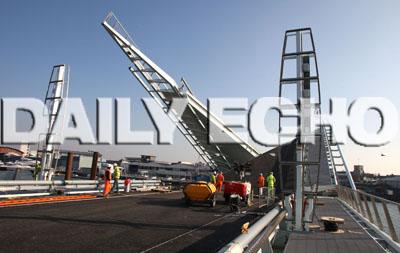 Final work is carried out on Poole's new Twin Sails bridge. 
