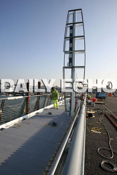 Final work is carried out on Poole's new Twin Sails bridge. 