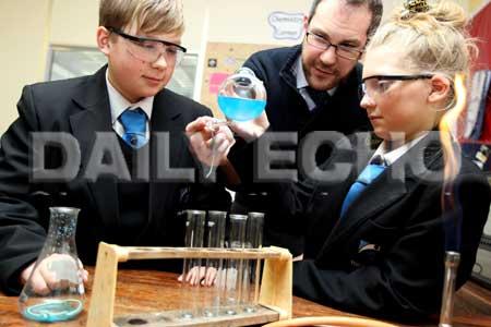 Indya Barnes,12, Ashleigh Treadwell,11 and teacher Graham Johnston in a year seven science lesson.