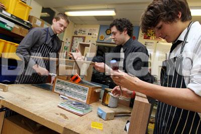 Year 11 Resistant Materials teacher Andrew Morris, centre, works with pupils Charlie Cheeseman, left, and Connor Perring.