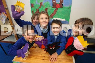 School report. Hillside First School in Verwood. Year 2 pupils with their puppets.