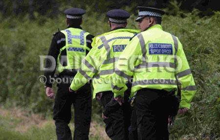 Police and forensic officers searching the woodland off Huntick Road between Lytchett Matravers and Lytchett Minster.