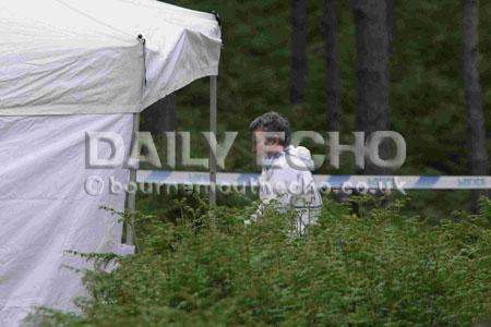 Police and forensic officers searching the woodland off Huntick Road between Lytchett Matravers and Lytchett Minster.