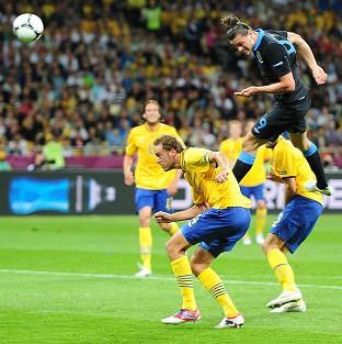 England's Andy Carroll scores the first goal of the Euro 2012 game against Sweden at the Olympic Stadium in Kiev, Ukraine