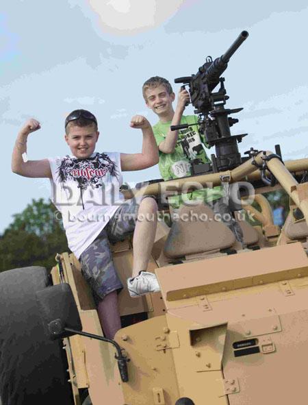 Around 10,000 people attended the 10th Tankfest celebration at the Bovington Tank Museum. Michael, 14, and left, Adam, 11, Langford with a Jackal