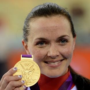 Cyclist Victoria Pendleton celebrates with her gold medal after winning the women's keirin final at the London 2012 Olympics