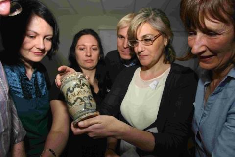 Paola Palma shows off an early 17th century apothecary jar found in the Swash Channel Wreck outside Poole Harbour