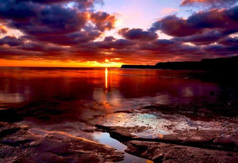 The sun setting over Kimmeridge Bay by Paul Read.