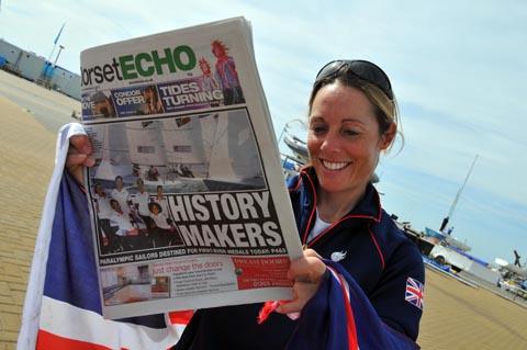 Helena Lucas reads about her medal success in the Dorset Echo