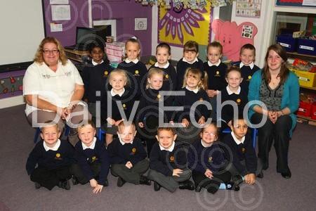 Reception children at Manorside Combined School in Poole with Teacher Emily Upshall, right, and TA Lynda Hardiman.
