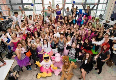 GROUP EFFORT: Pupils and staff at Poole High School dress up as ballerinas and ballroom dancers