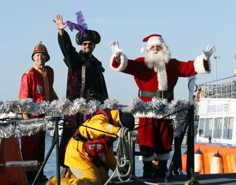People flock to Poole Quay to see the arrival of Santa by RNLI lifeboat, then watch the Christmas procession down the high street to the Dolphin Centre.