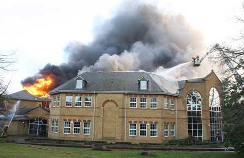 Between 50-60 firefighters are dealing with a fire at Lytchett Minster School's theatre block. 