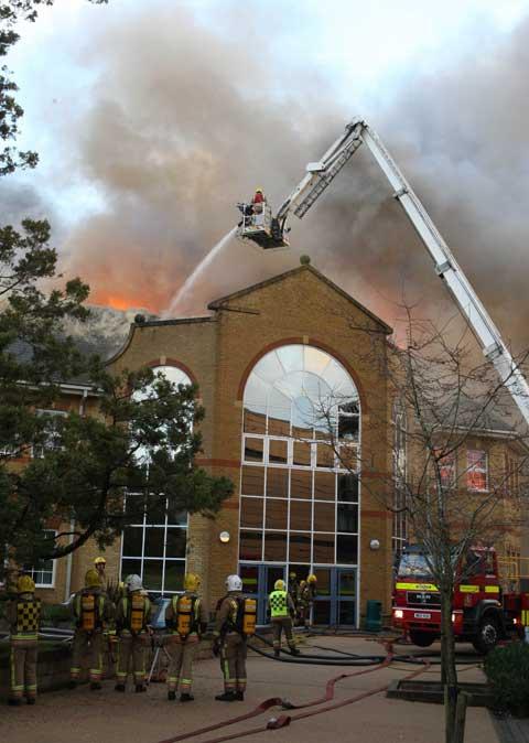 Between 50-60 firefighters are dealing with a fire at Lytchett Minster School's theatre block. 