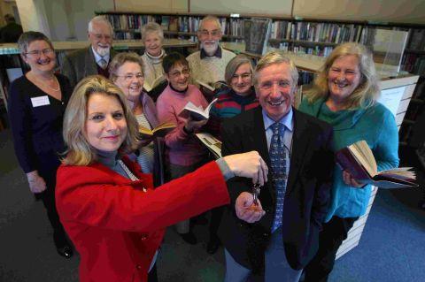 PRESENTATION: Dorset County Council chief executive Debbie Ward presents the keys to Friends of Wool Library chairman David Smith and library volunteers
