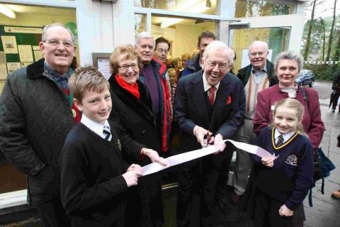 IT’S OFFICIAL: Actor Michael Medwin and Annette Brooke MP cut the ribbon to open Colehill Library as a community run library