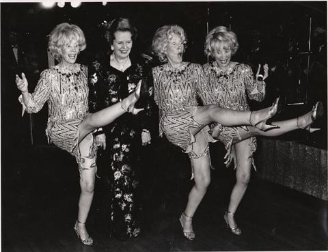 Prime Minister Margaret Thatcher joins in the fun with the Beverley Sisters at the Tory Party Ball in Bournemouth on 11 October 1990